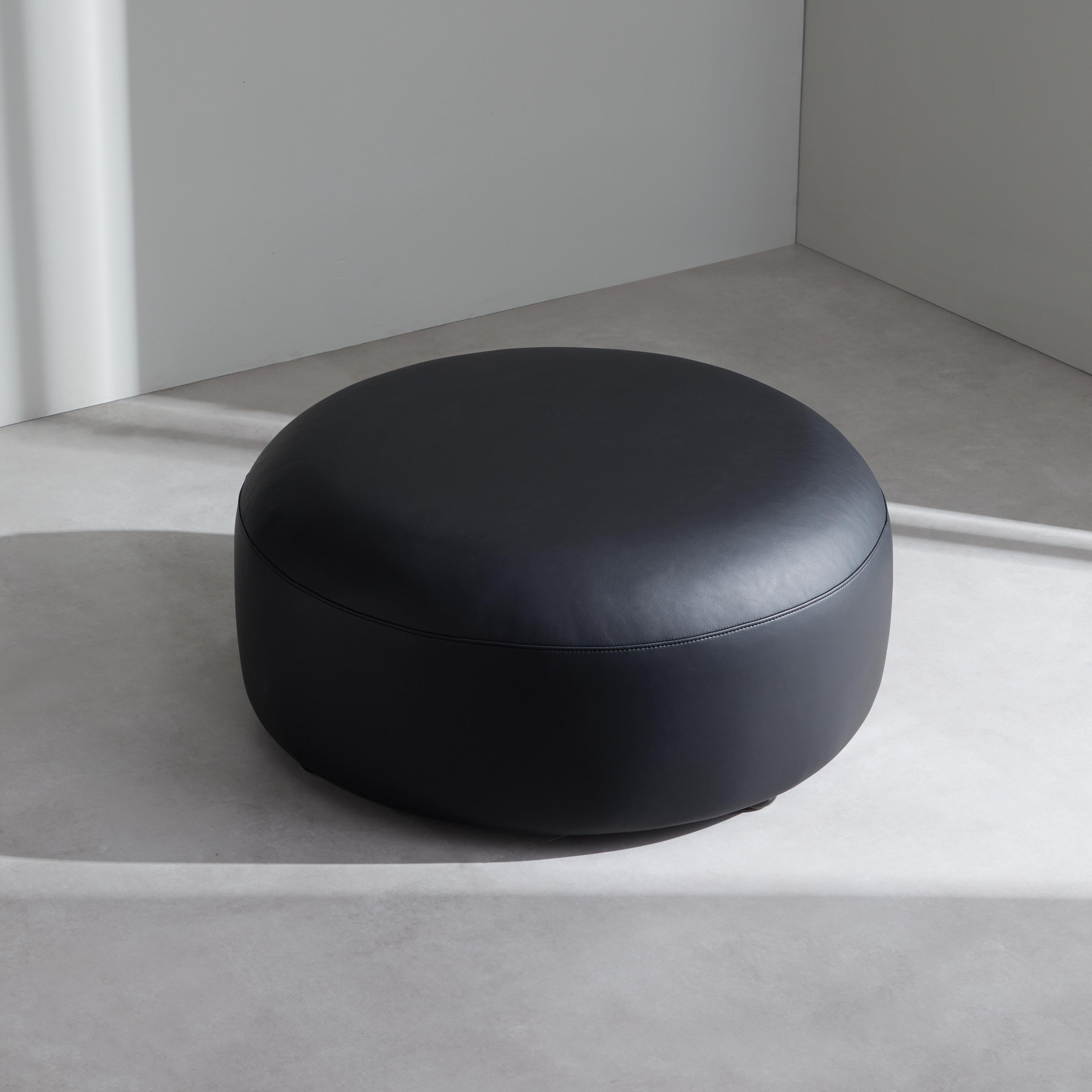 Monolith Round Black Leather Ottoman