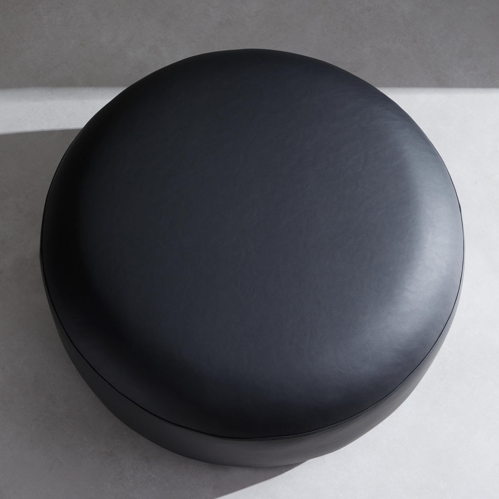 Monolith Round Black Leather Ottoman