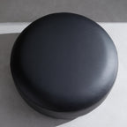 Monolith Round Black Leather Ottoman