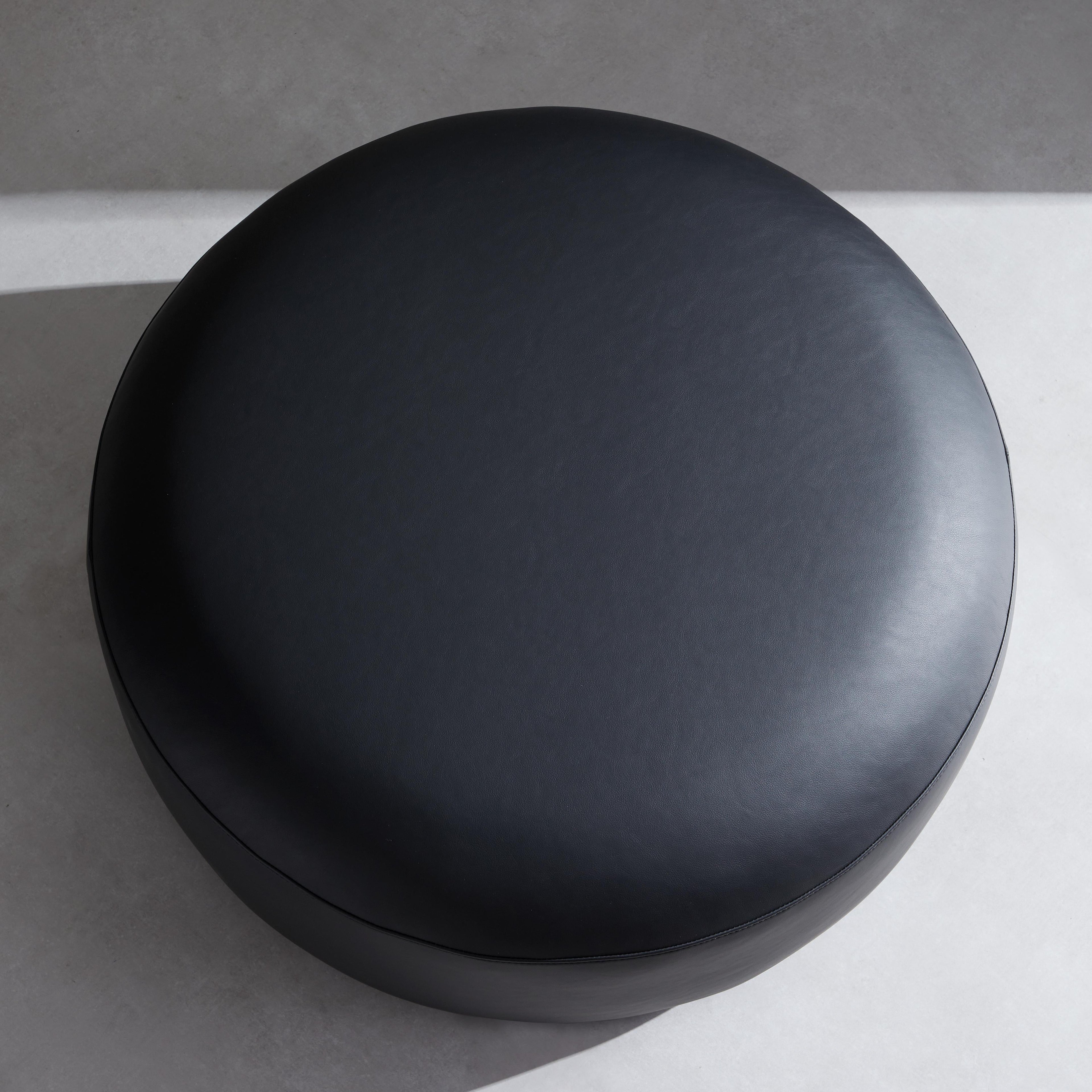 Monolith Round Black Leather Ottoman