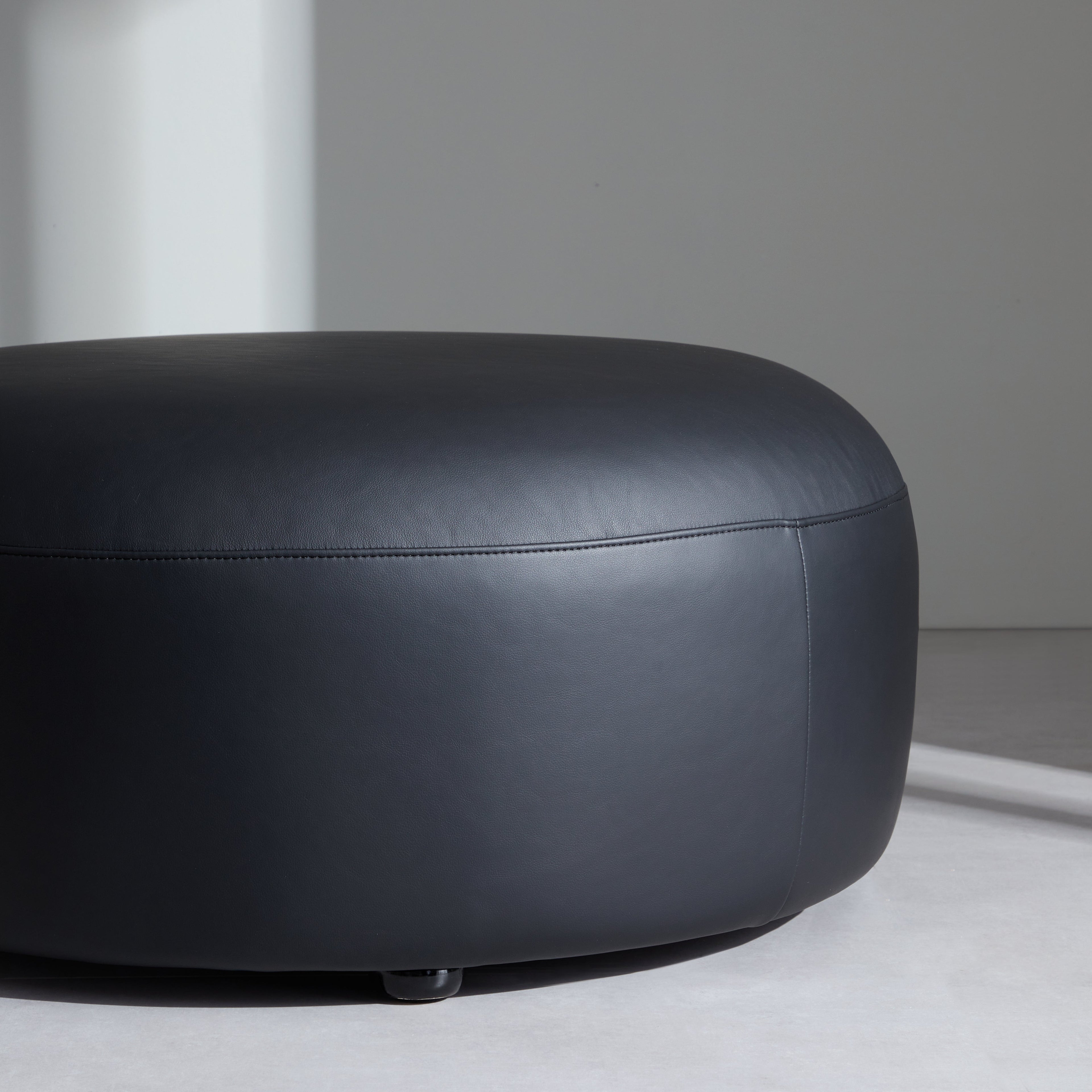 Monolith Round Black Leather Ottoman