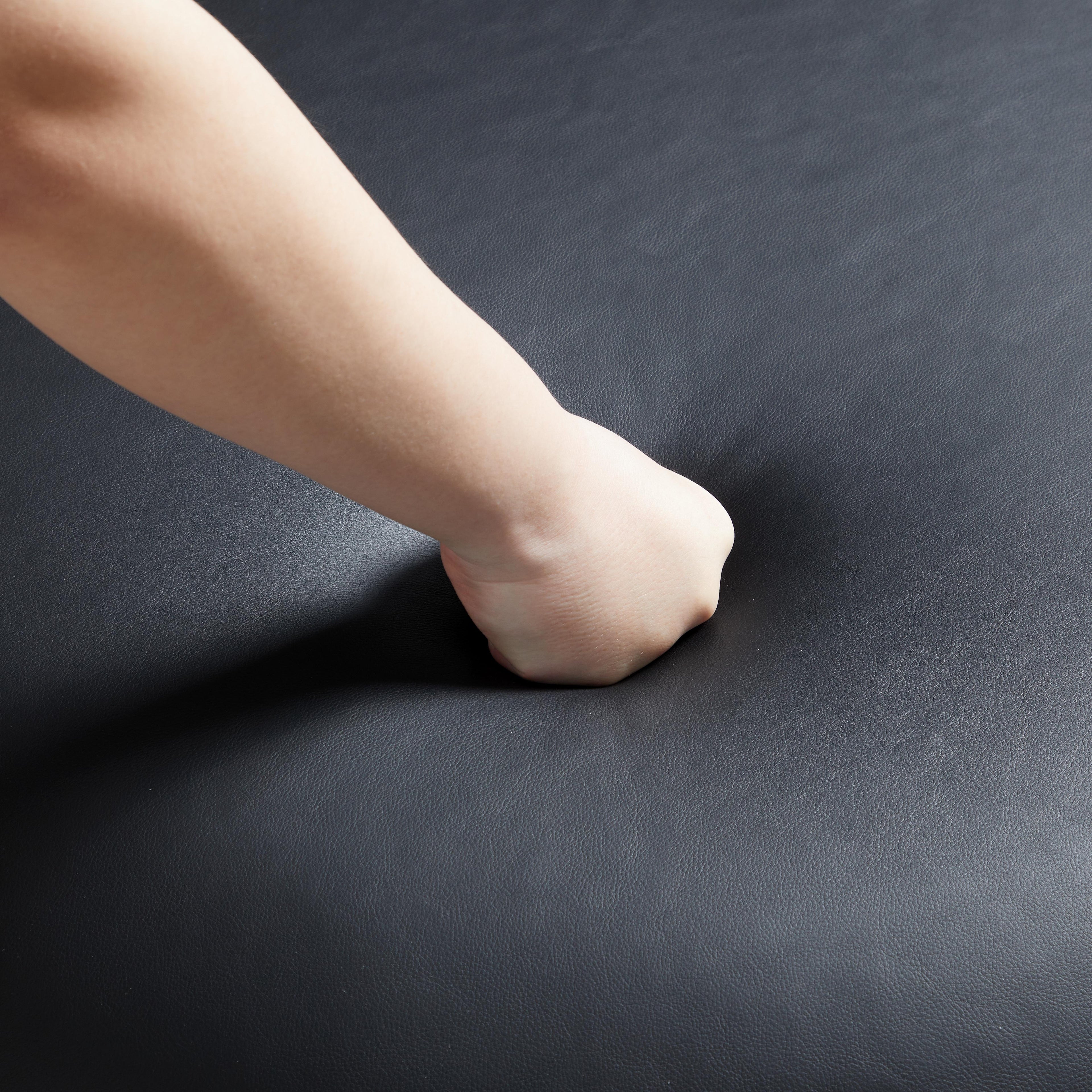 Monolith Round Black Leather Ottoman