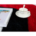 Tapis à poils longs Mateos au design abstrait